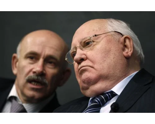 	 Former Soviet leader Gorbachev and his interpreter listen to a question from students in Chicago. Apr 23, 2012. Photo By JEFF HAYNES/REUTERS
