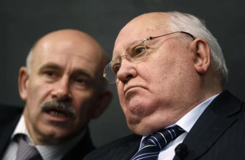 	 Former Soviet leader Gorbachev and his interpreter listen to a question from students in Chicago. Apr 23, 2012. Photo By JEFF HAYNES/REUTERS