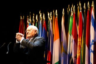 Mikhail Gorbachev clasps his hands in recognition of the audience after he's introduced by Lynn Wyatt as a speaker in the Brilliant Lecture Series, Thursday, Nov. 1, 2012, in the Wortham Center in Houston. Gorbachev spoke about his environmental and humanitarian causes and leading the USSR during the Cold War.